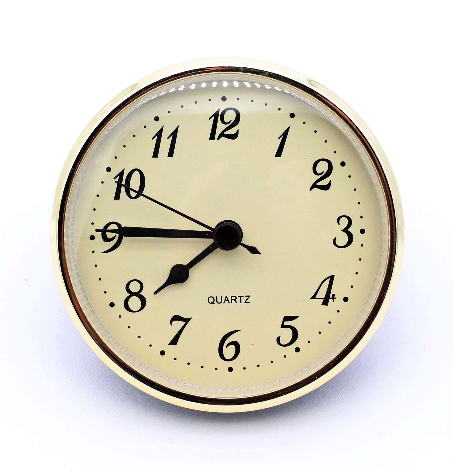 3 1/2 inch quartz clock insert fit-up movement with cream Arabic dial, black spade hands, and gold bezel